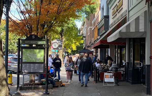 Shot of people dining and shopping on Broadway Street in  Downtown Saratoga Springs