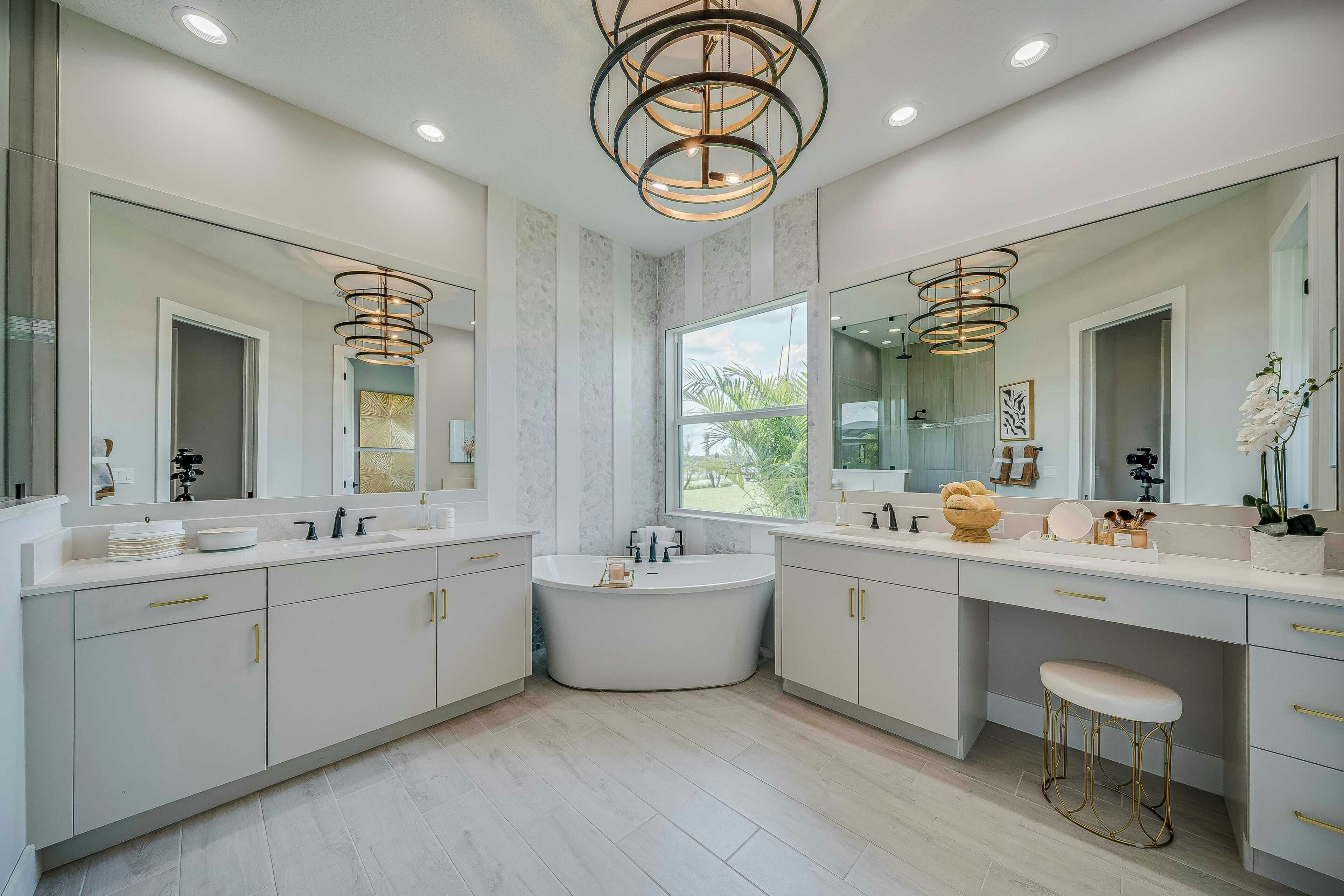 Master bath with wood tile floor, split vanity and corner soaking tub