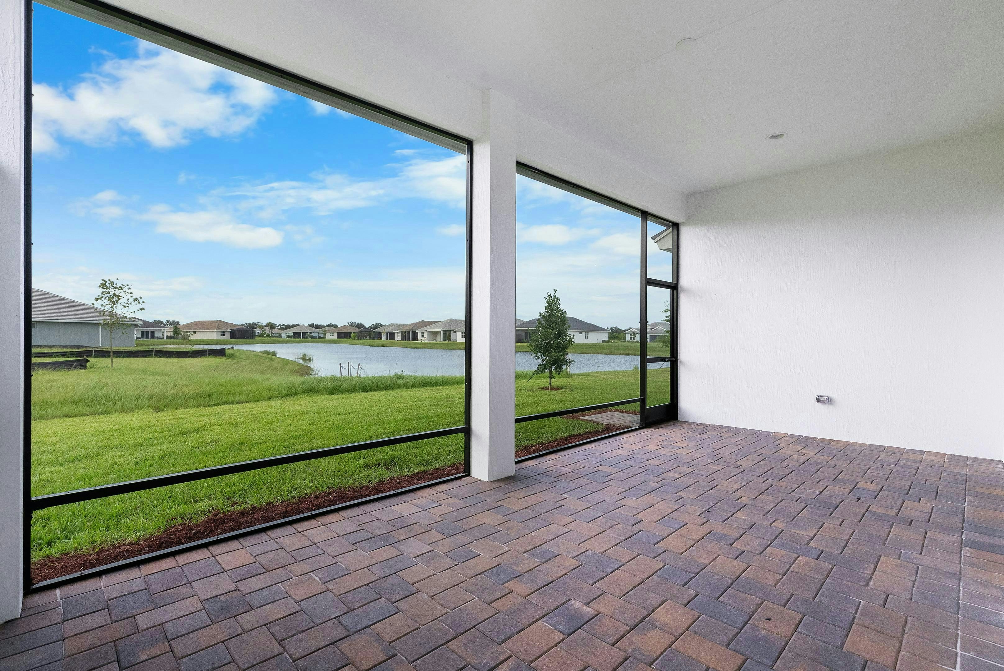 Lanai to lake view | 12398 SW Sunrise Lake Terrace