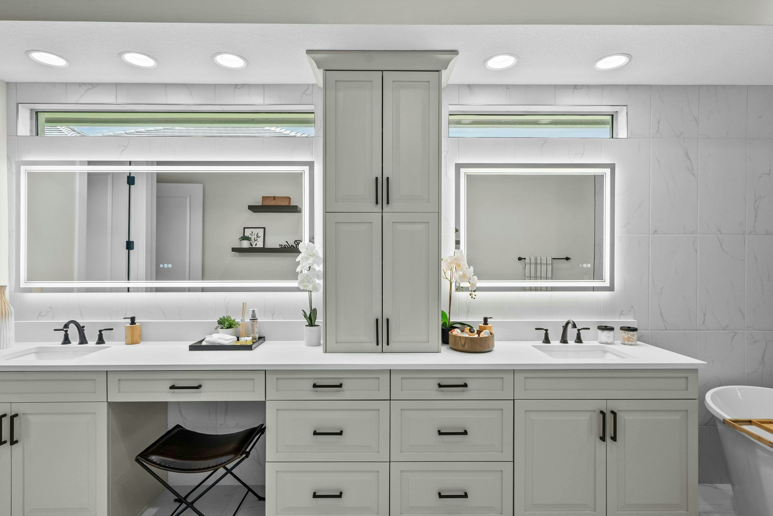 Master Bath in grey tones with dual vanity and LED light mirrors