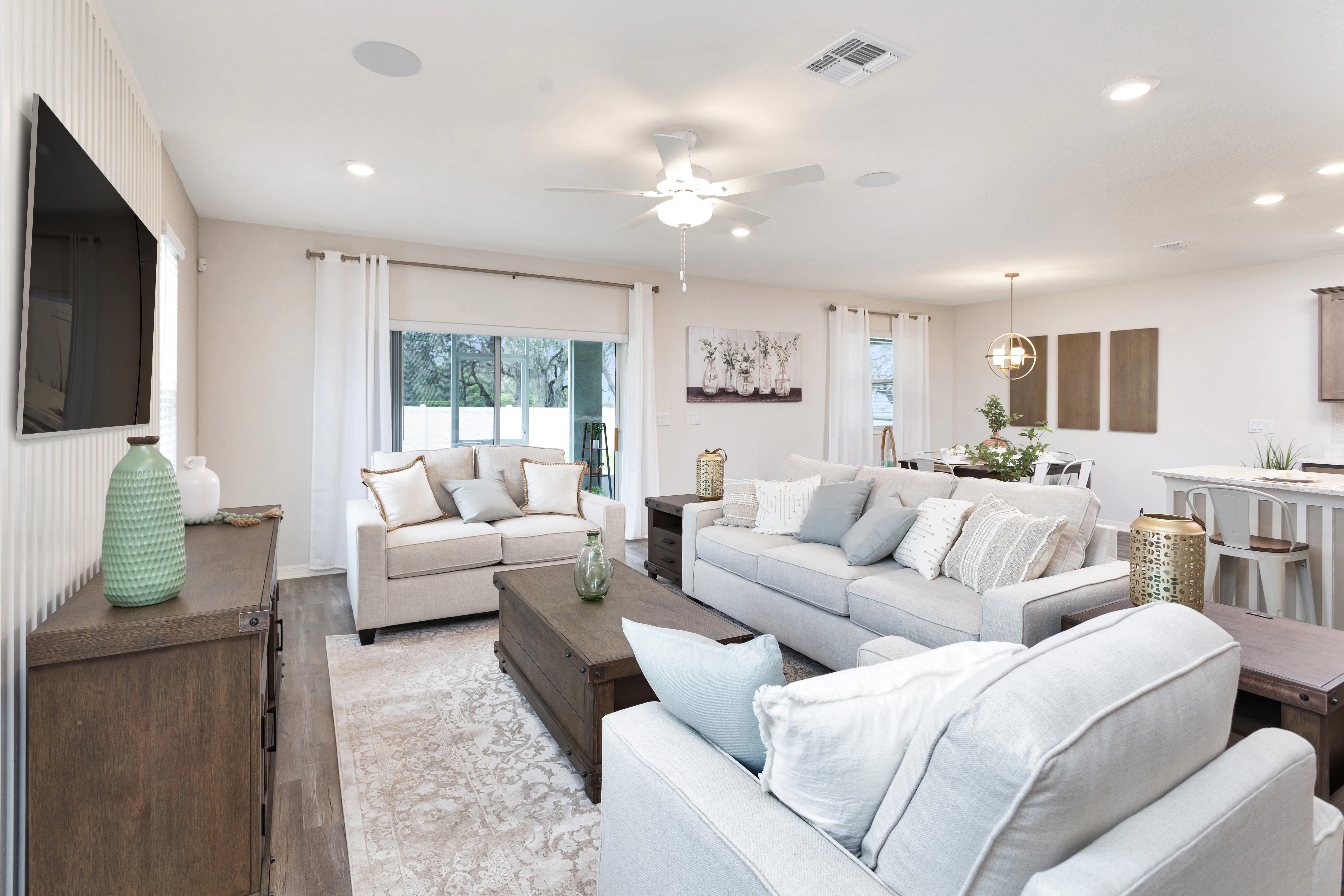 The large gathering room in the Wesley II by Highladnd Homes offers a wide range of furniture layout options