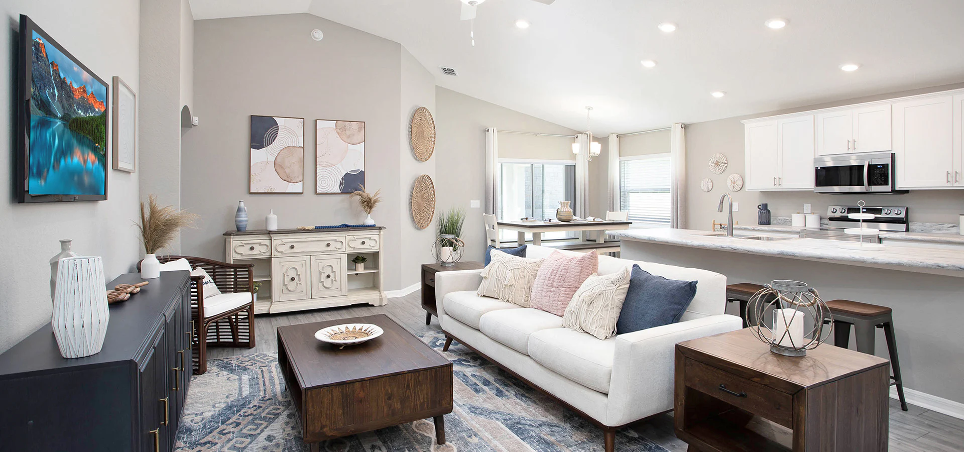 Open living area with light colors and mid century style furniture