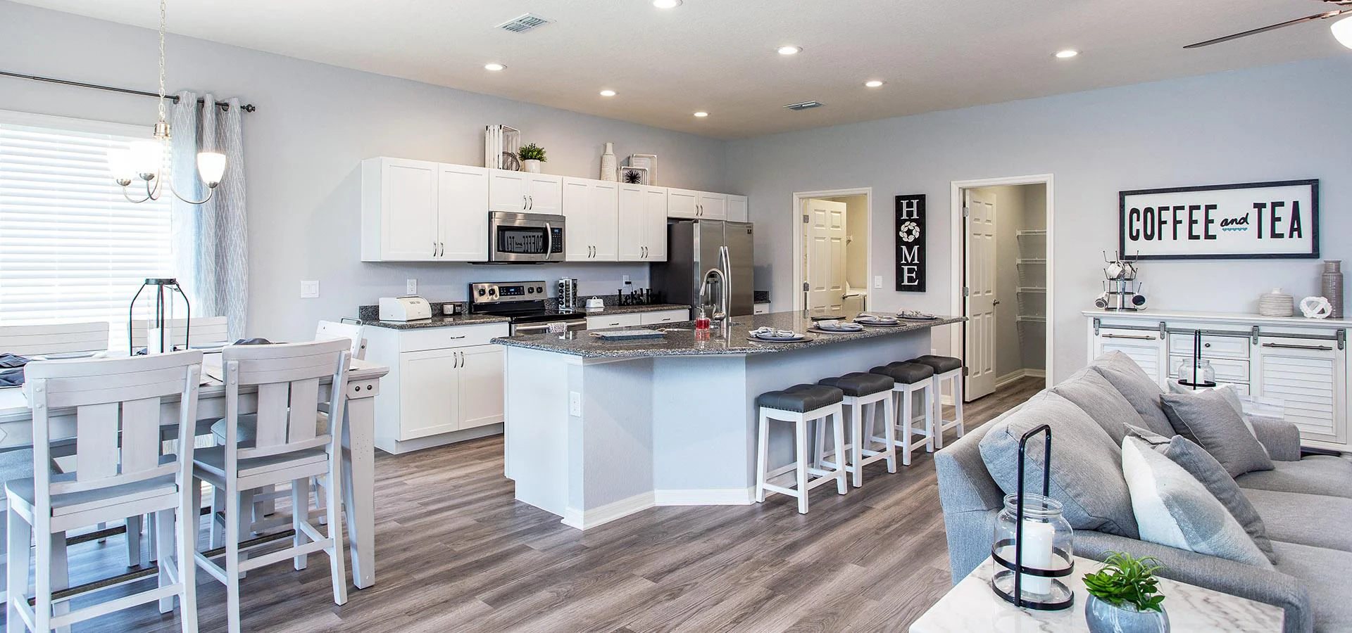 Open kitchen with dining table and counter-height island