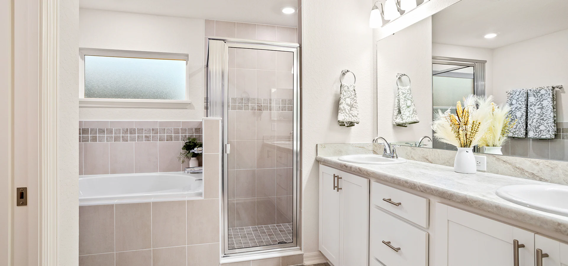 En-suite bathroom with a garden bathtub and separate tiled shower
