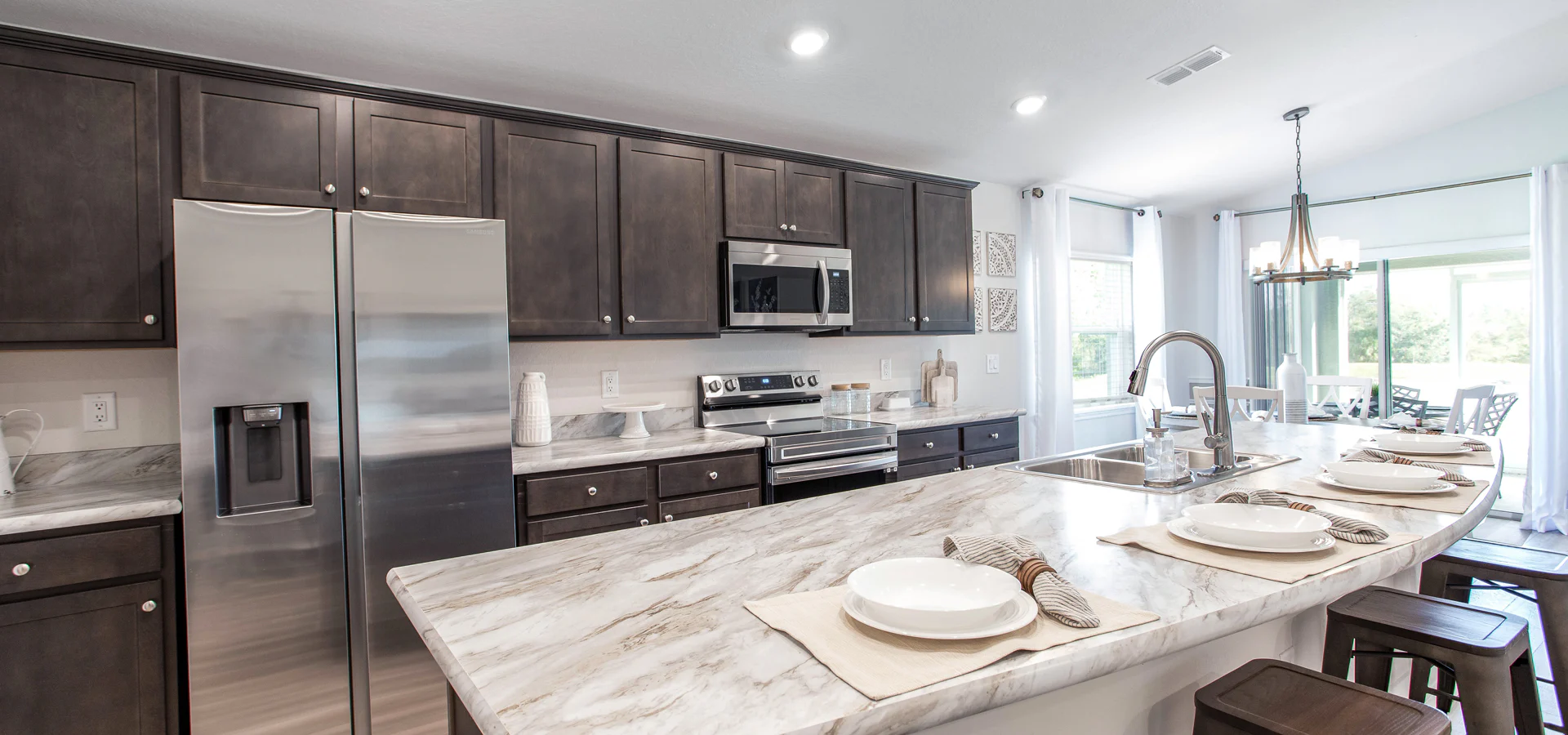 Kitchen with wood cabinets and countertops resembling granite