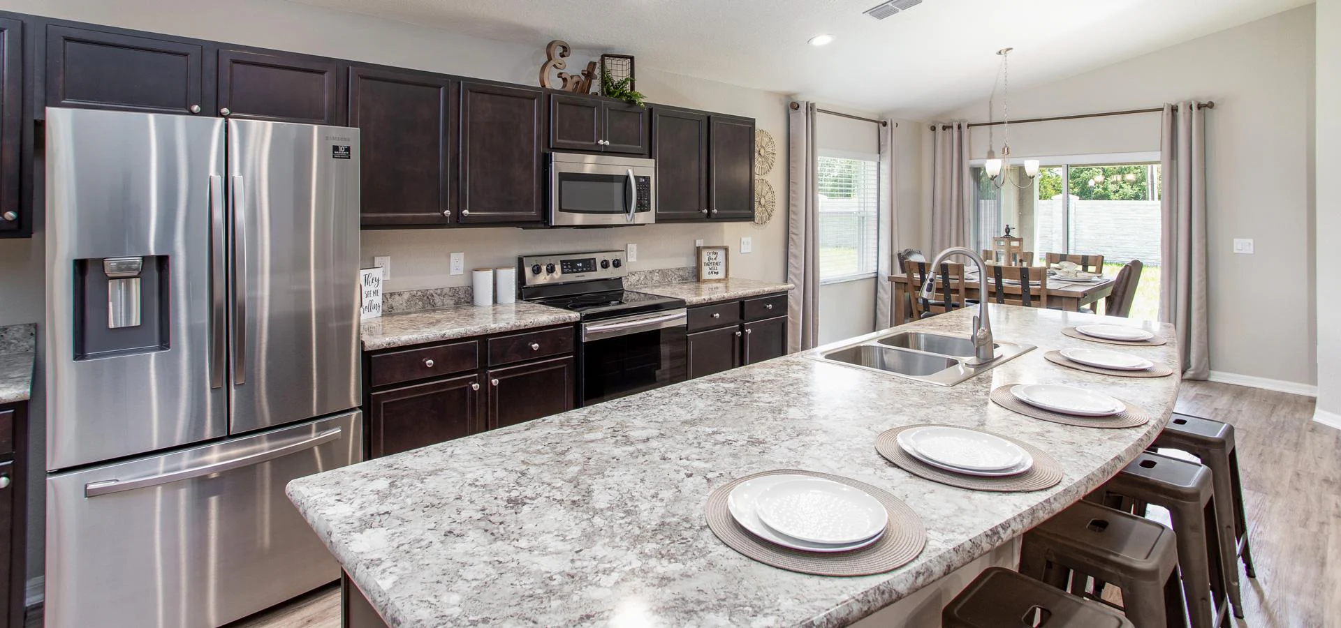 Kitchen with stainless steel appliances and counter-height island