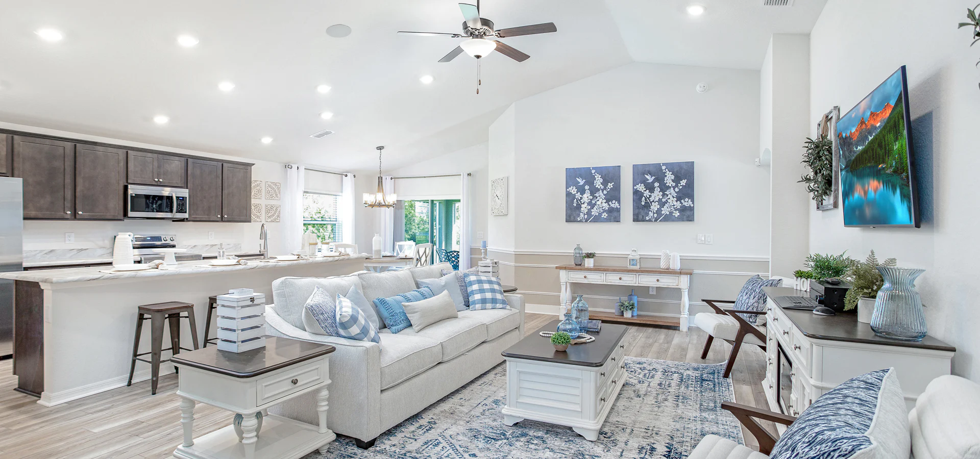 Warm and welcoming open living area in the Raychel by Highland Homes in Florida.