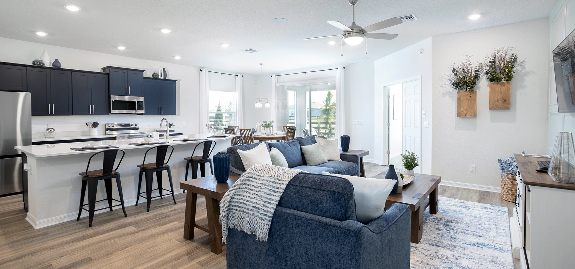 Open living area combining navy blue and white decor